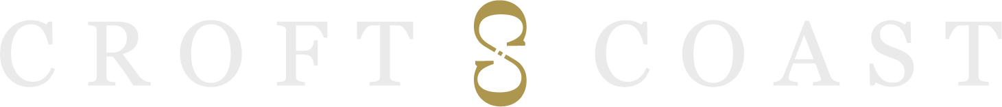The Croft & Coast brand logo featuring white lettering with a central gold ampersand design, set against a transparent background.